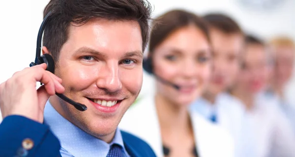 Attractive positive young businesspeople and colleagues in a call center office — Stock Photo, Image