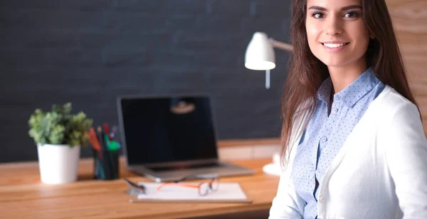 Young female working sitting at a desk — Stock Photo, Image