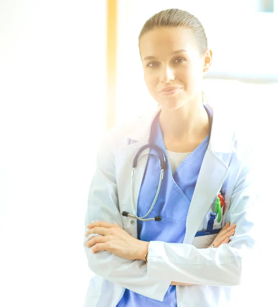 Woman doctor standing at hospital near window — Stock Photo, Image