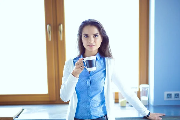 Happy woman drinking tea in the kitchen at home. Woman at home — Stock Photo, Image