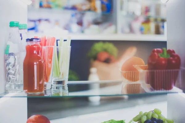 Open refrigerator with fresh fruits and vegetable. Open refrigerator