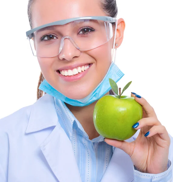 Mulher sorridente médico com uma maçã verde — Fotografia de Stock