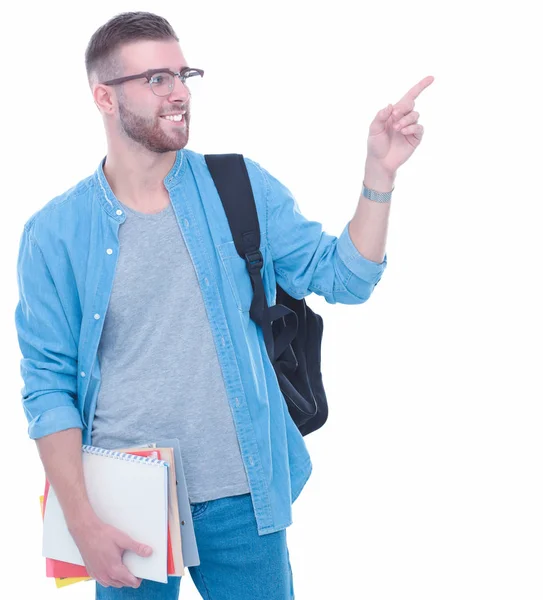 Studente maschio con una borsa della scuola che tiene libri isolati su sfondo bianco — Foto Stock