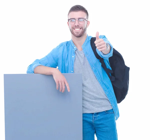 Portret van een lachende mannelijke student bedrijf leeg bord — Stockfoto