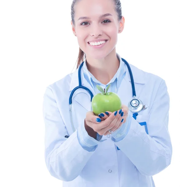 Mulher sorridente médico com uma maçã verde — Fotografia de Stock