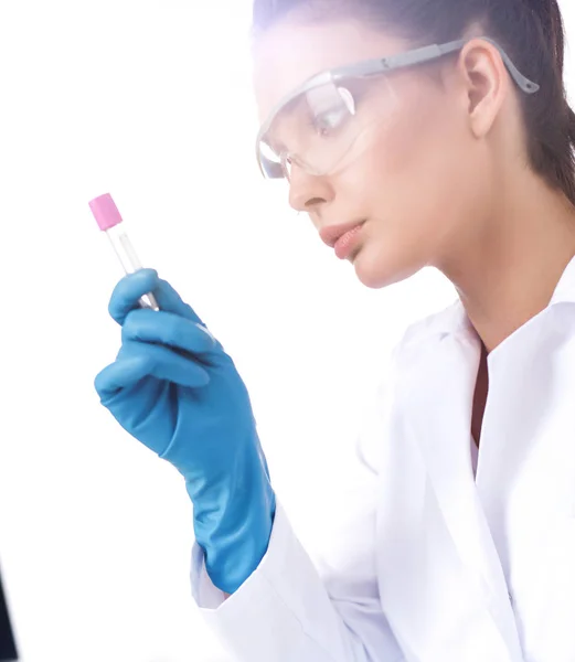 Woman researcher is surrounded by medical vials and flasks, isolated on white background — Stock Photo, Image