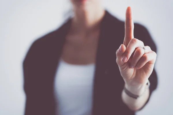 Frau berührt imaginären Bildschirm mit dem Finger - isoliert — Stockfoto