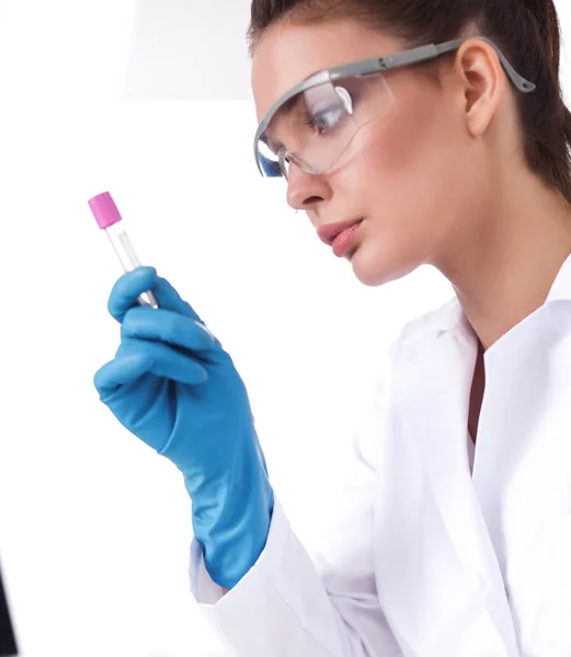 Woman researcher is surrounded by medical vials and flasks, isolated on white background — Stock Photo, Image