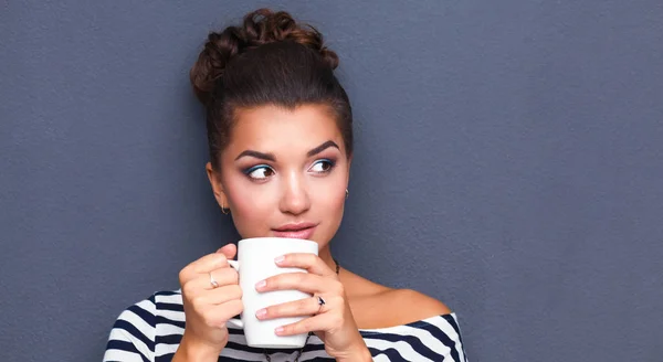Portrait of young woman with cup tea or coffee — Stock Photo, Image