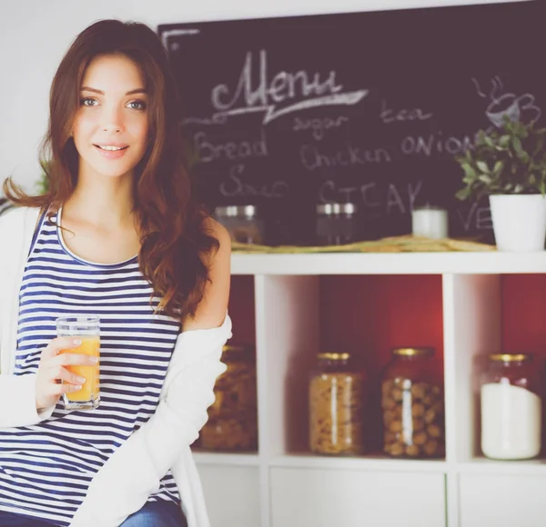 Portrait of a pretty woman holding glass with tasty juice — Stock Photo, Image