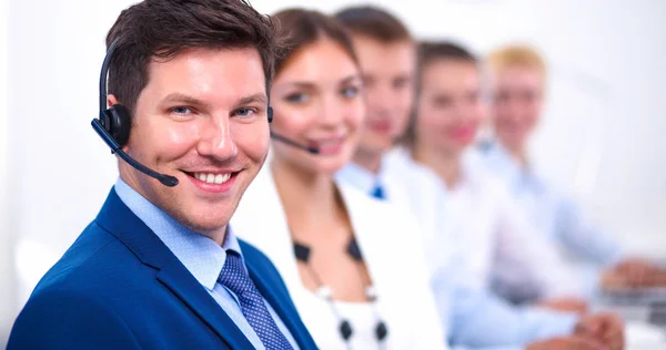 Attractive Smiling positive young businesspeople and colleagues in a call center office — Stock Photo, Image