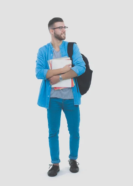 Um estudante do sexo masculino com um saco escolar com livros isolados sobre fundo branco. Oportunidades educativas. Estudante universitário . — Fotografia de Stock