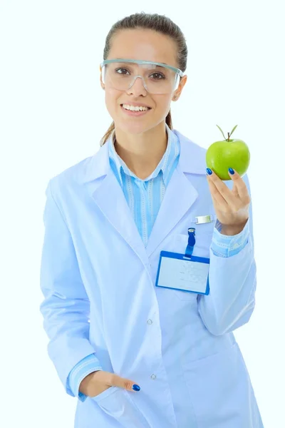 緑色のリンゴで笑顔の女性医師。女医 — ストック写真