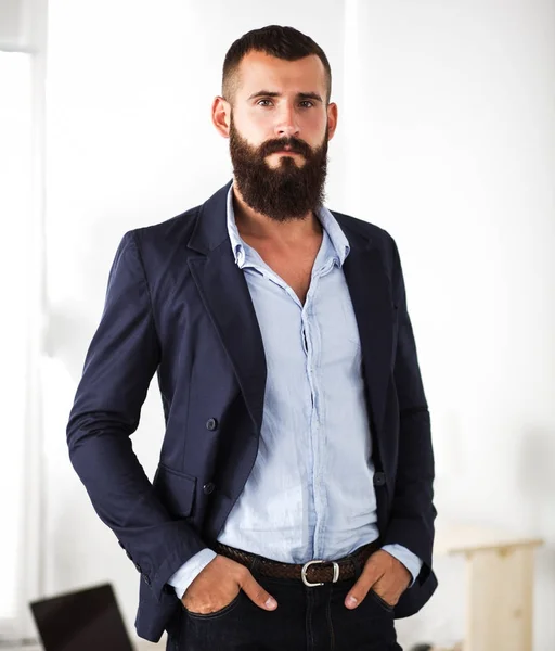 Portrait of handsome man standing, isolated on grey background — Stock Photo, Image