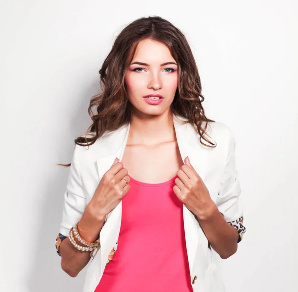 Young woman wearing a pink dress standing — Stock Photo, Image