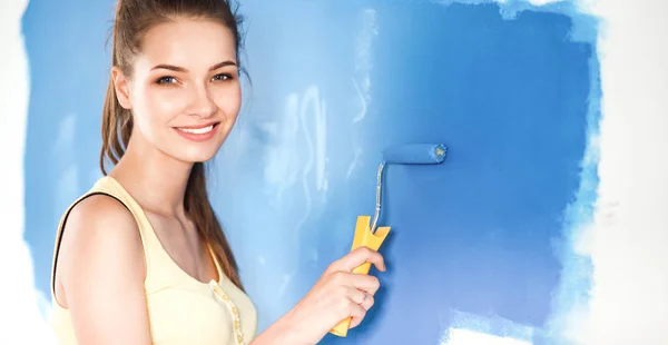 Happy beautiful young woman doing wall painting — Stock Photo, Image