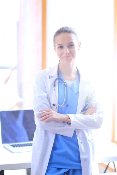 Woman doctor standing near window at hospital. Woman doctor — Stock Photo, Image