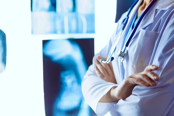 Image of attractive woman doctor looking at x-ray results — Stock Photo, Image