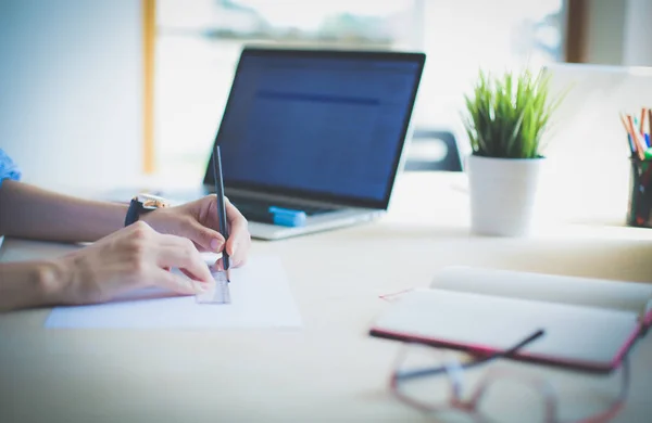 Young woman sitting at office table with laptop. Young woman. Laptop — Stock Photo, Image