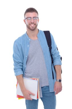 Beyaz arka plan üzerinde izole kitap tutan bir okul çantası ile bir erkek öğrenci. Eğitim olanakları. Üniversite öğrencisi.