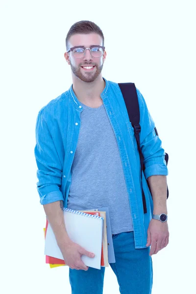 Een mannelijke student met een schooltas boeken geïsoleerd op een witte achtergrond te houden. Onderwijsaanbod. College student. — Stockfoto