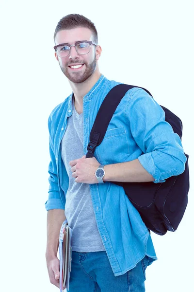 Een mannelijke student met een schooltas boeken geïsoleerd op een witte achtergrond te houden. Onderwijsaanbod. College student. — Stockfoto