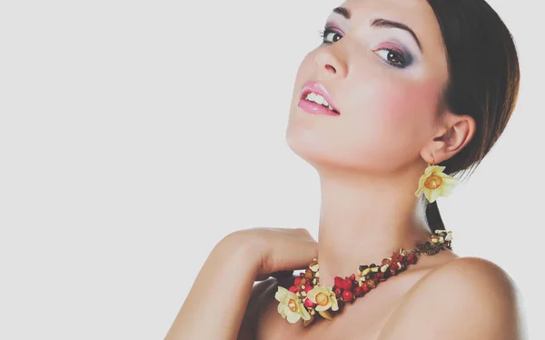 Portrait of young beautiful brunette woman in beads — Stock Photo, Image