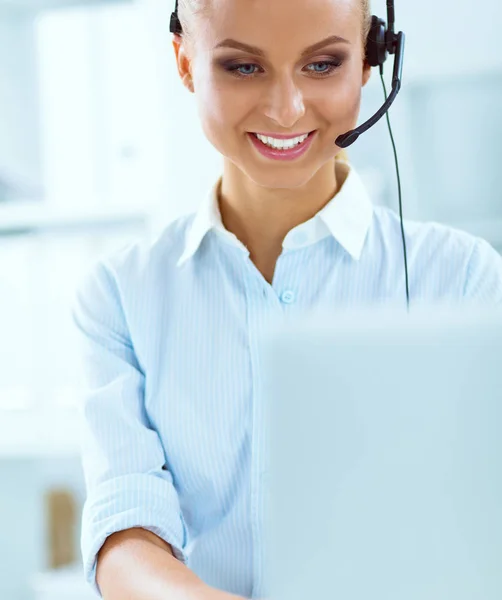 Close-up portrait of a customer service agent sitting at office — Stock Photo, Image