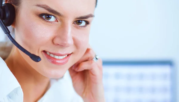 Close-up portrait of a customer service agent sitting at office — Stock Photo, Image