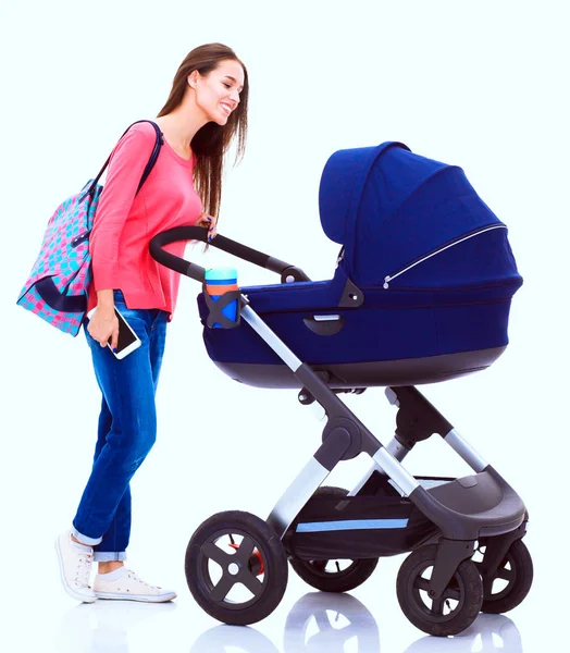 Full length portrait of a mother with a stroller, isolated on white background — Stock Photo, Image