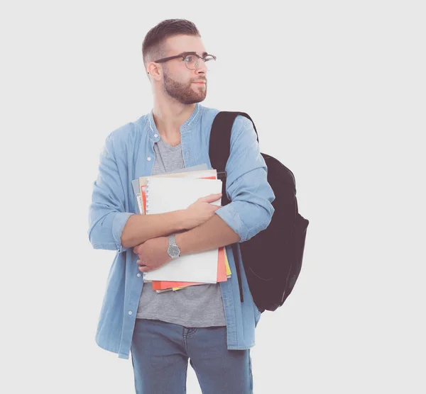 Ung manlig student med väska håller böcker isolerad på vit bakgrund — Stockfoto