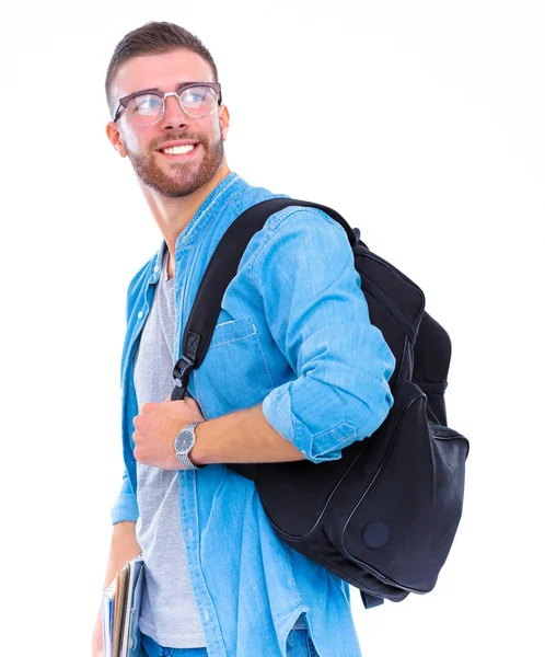 Un estudiante masculino con una bolsa de la escuela sosteniendo libros aislados sobre fondo blanco —  Fotos de Stock