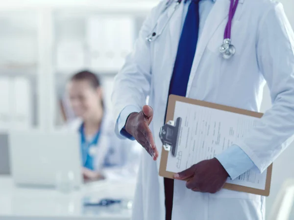 Male medicine doctor offering hand to shake in office closeup. Doctors — Stock Photo, Image