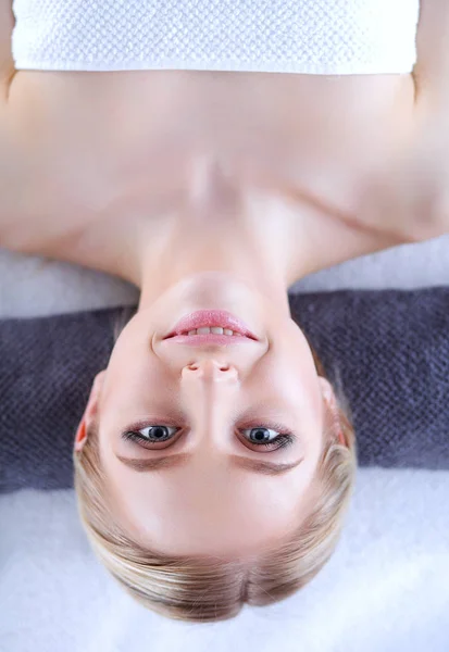 Young woman lying on a massage table,relaxing. Woman. Spa salon — Stock Photo, Image
