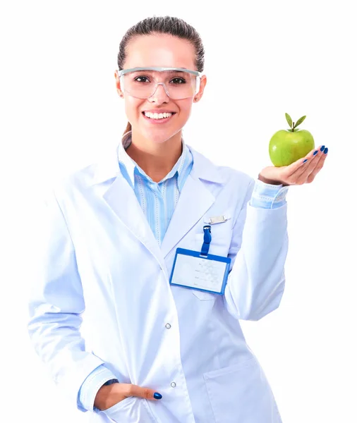 Sorridente medico donna con una mela verde — Foto Stock