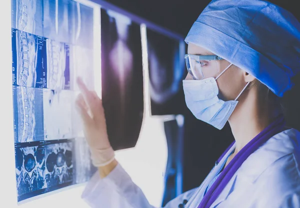 Two female women medical doctors looking at x-rays in a hospital. — Stock Photo, Image