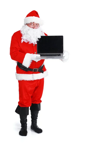 Santa Claus prezentuje laptopa na białym tle — Zdjęcie stockowe