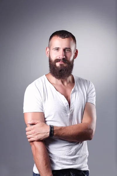 Portrait of handsome man standing, isolated on grey background — Stock Photo, Image