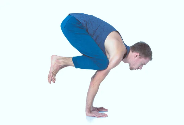 Adult man with naked torso doing exercise on white background — Stock Photo, Image