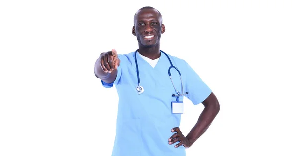 Pohledný mladý lékař ukazováčkem na sebe izolované na bílém pozadí — Stock fotografie