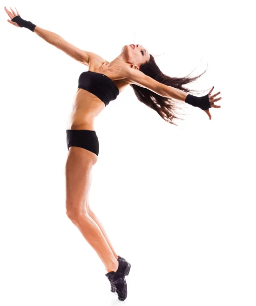Elegante y joven bailarina de estilo moderno saltando — Foto de Stock