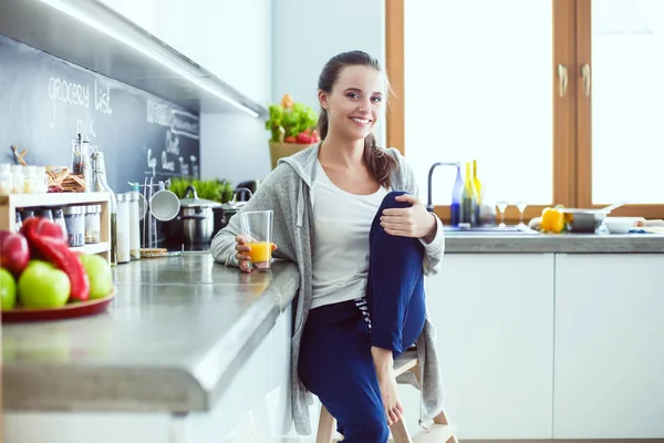 Woman in the kitchen. Cooking at kitchen.