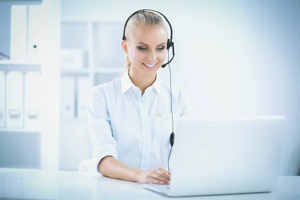 Close-up portrait of a customer service agent sitting at office — Stock Photo, Image