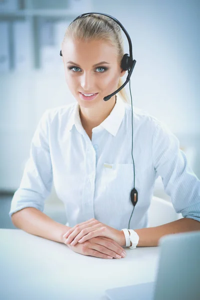 Close-up portrait of a customer service agent sitting at office — Stock Photo, Image