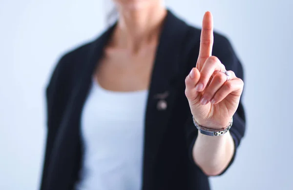 Vrouw die een denkbeeldig scherm aanraakt met haar vinger — Stockfoto