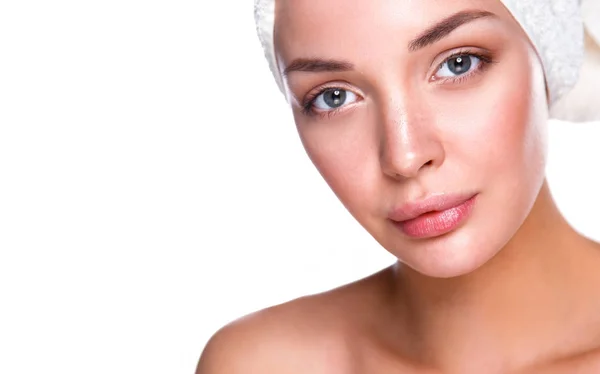 Beautiful woman with a towel on her head — Stock Photo, Image