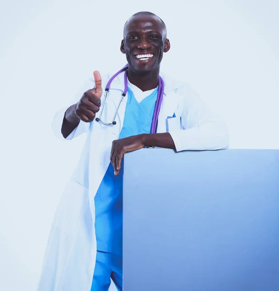 Portrait of doctor showing you ok sign standing in a white uniform on isolated background — Stock Photo, Image