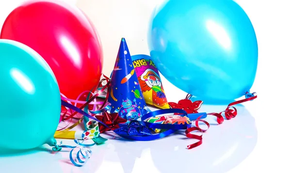 Party decoration - balloon, party hats isolated on white background