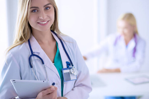 Woman doctor standing with stethoscope at hospital . Woman doctor