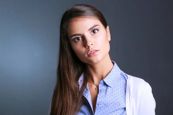 Portrait of a businesswoman , against dark background. Woman smiling. Portrait of a woman — Stock Photo, Image